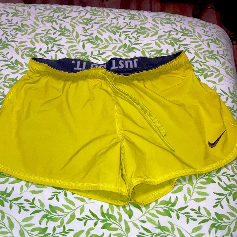 Size M Nike shorts bright neon green/yellow with dark grey elastic lightly worn